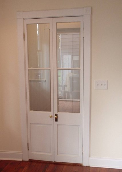 The same French doors restored, re-glazed, and rehung.