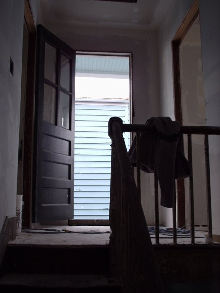 Rear interior door open to the back porch during work.