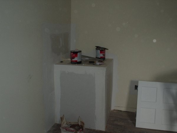 Chimney chase enclosed in drywall during interior framing.